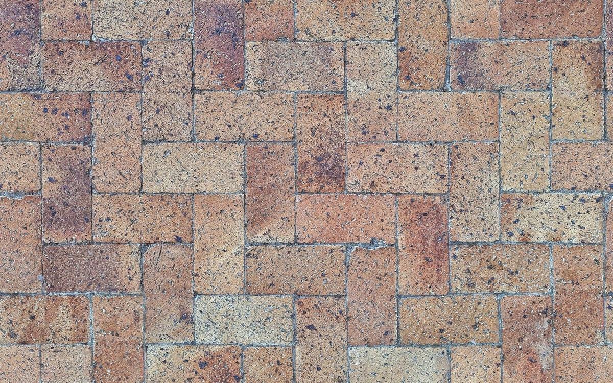 Clay block paving laid in a herringbone pattern